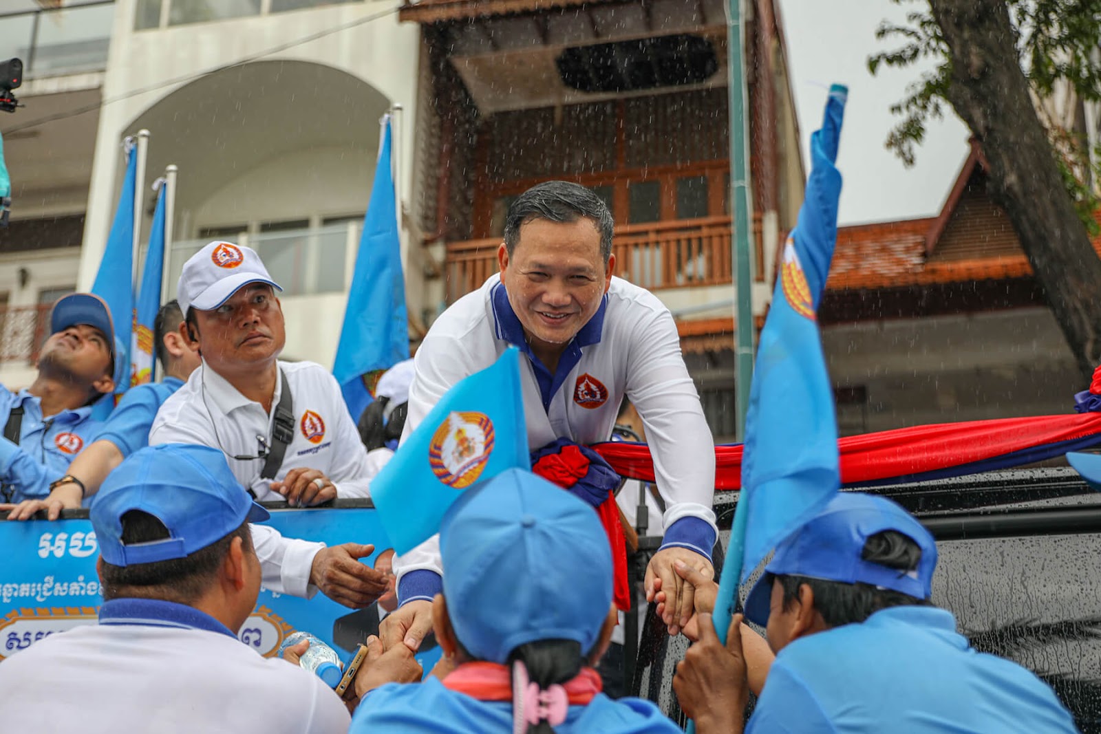 With motorcade, Cambodia’s ruling party marks expected election victory